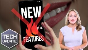 A woman stands beside a large image of a smartphone displaying the words "NEW BETA FEATURES" with a red cross over it. The graphic includes a "TECH UPDATE" label.