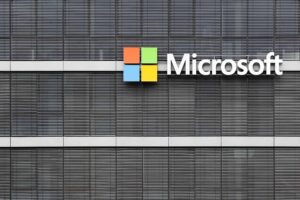 A building facade featuring the Microsoft logo with a colored square icon beside the company's name.
